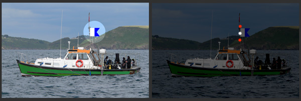 A small vessel engaged in diving operations showing flag A and appropriate lights