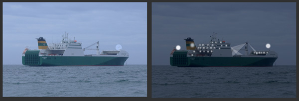 A vessel at anchor with deck lights lit