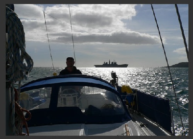 View astern from a small boat of an aircraft carrrier
