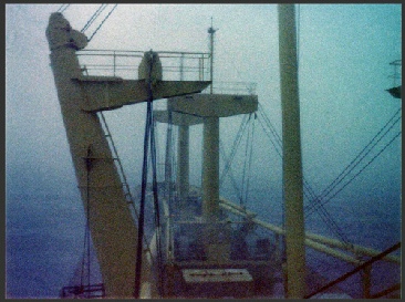 Late morning in the Caribbean.  View from the bridge of cargo ship in heavy rain