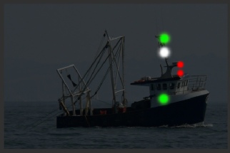 Trawler under 50m making way - seen from starboard - net has come fast