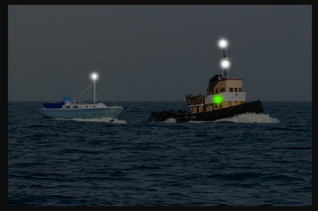 A dismasted yacht being towed by a harbour or coastal tug - yacht has a spar rigged to allow a light to be displayed