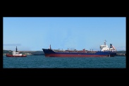 A tug (under 50m) towing a large vessell